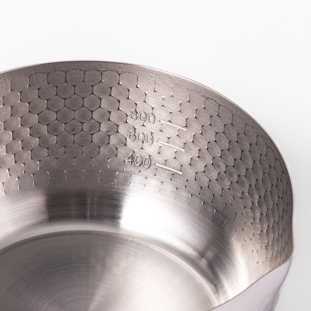 Japanese stainless steel yukihira pot with wooden handle and hammered texture, ideal for boiling soup or simmering dishes