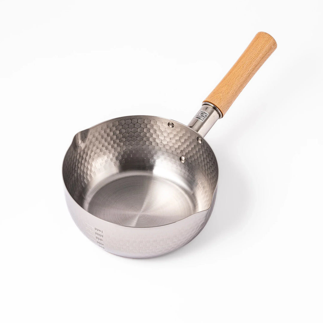 Stainless steel Yukihira pot with a wooden handle featuring a hammered texture and dual pour spouts.