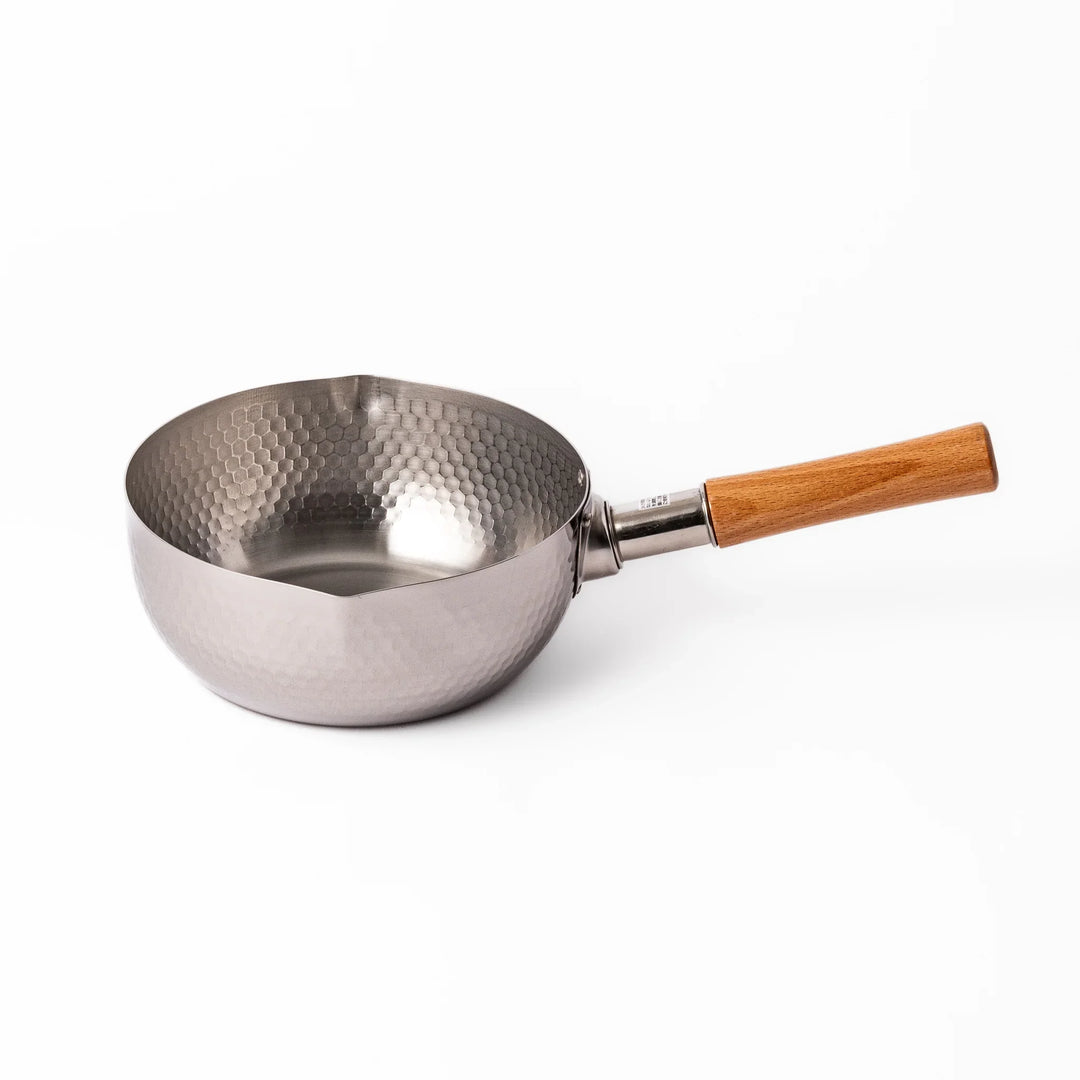 Japanese stainless steel yukihira pot with wooden handle and hammered texture, ideal for boiling soup or simmering dishes