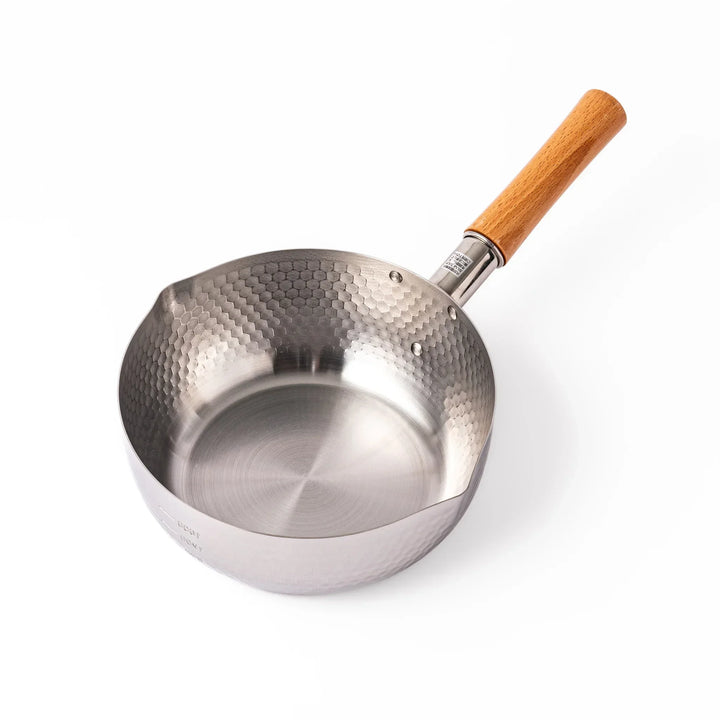 Japanese stainless steel yukihira pot with wooden handle and hammered texture, ideal for boiling soup or simmering dishes