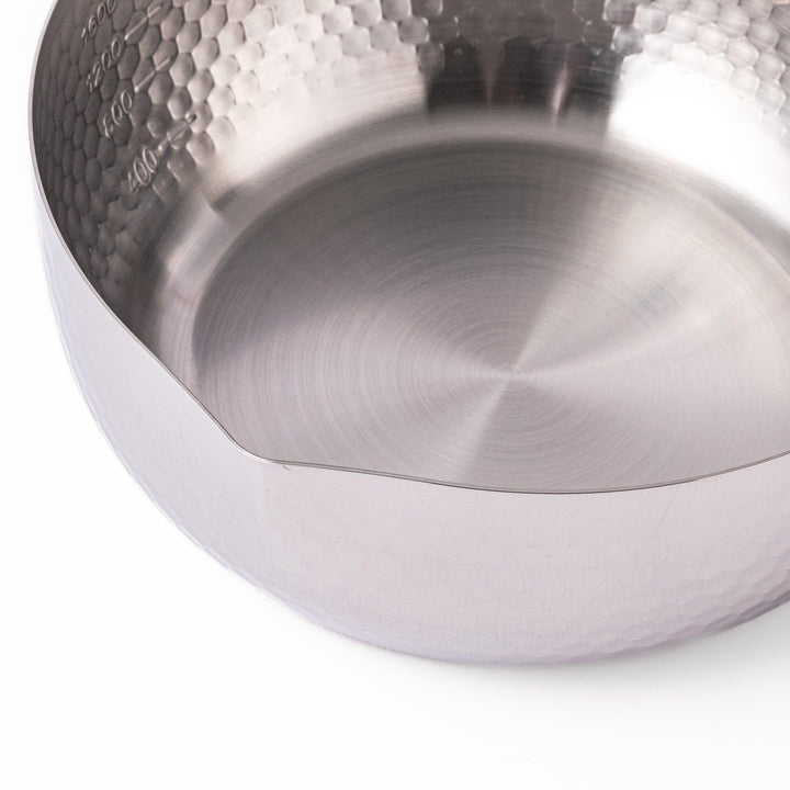 Japanese stainless steel yukihira pot with wooden handle and hammered texture, ideal for boiling soup or simmering dishes