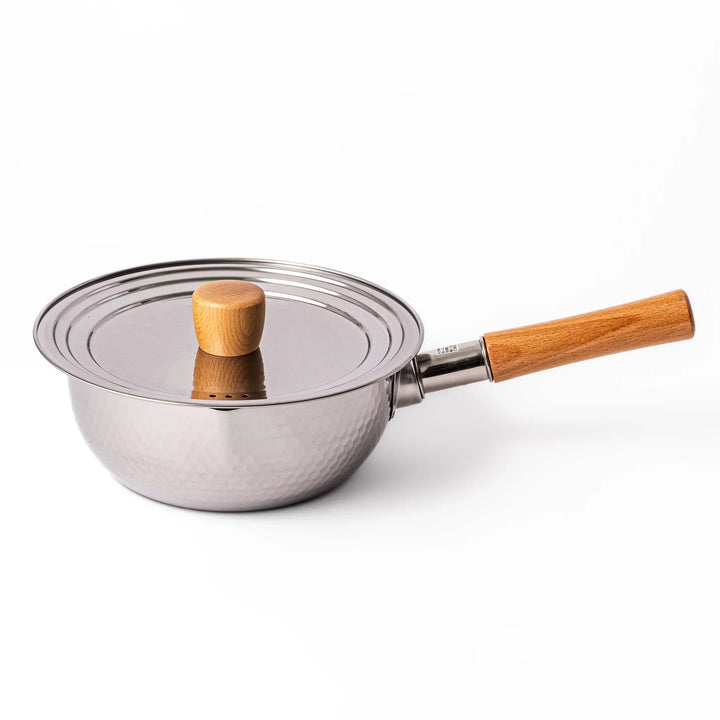 Stainless steel lid with wooden knob on Japanese yukihira pot with hammered finish and wooden handle for daily cooking