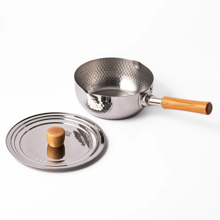 Stainless steel lid with wooden knob on Japanese yukihira pot with hammered finish and wooden handle for daily cooking
