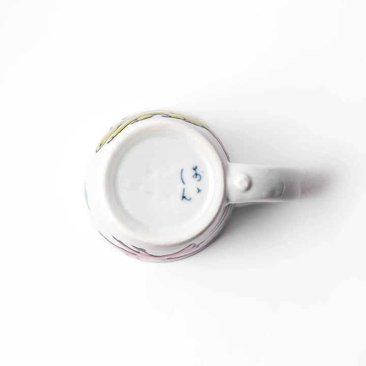 White ceramic kids mug featuring green stegosaurus dinosaur with round handle, shown on white background