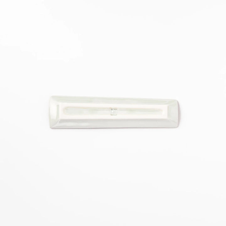 Japanese porcelain chopstick rest with whimsical China design featuring red pagoda, pandas, bamboo, and green tree accents