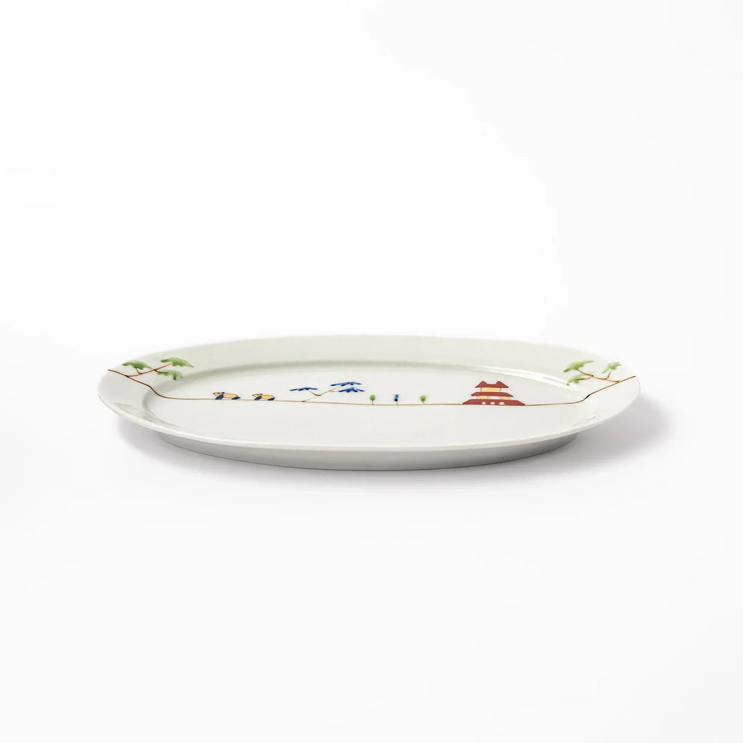 Japanese porcelain oval plate with whimsical China design featuring pandas, bamboo trees, and a traditional red pagoda