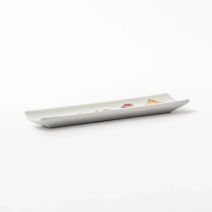 Japanese porcelain chopstick rest with whimsical Egypt design featuring pyramid, camel, cactus, and colorful palm trees