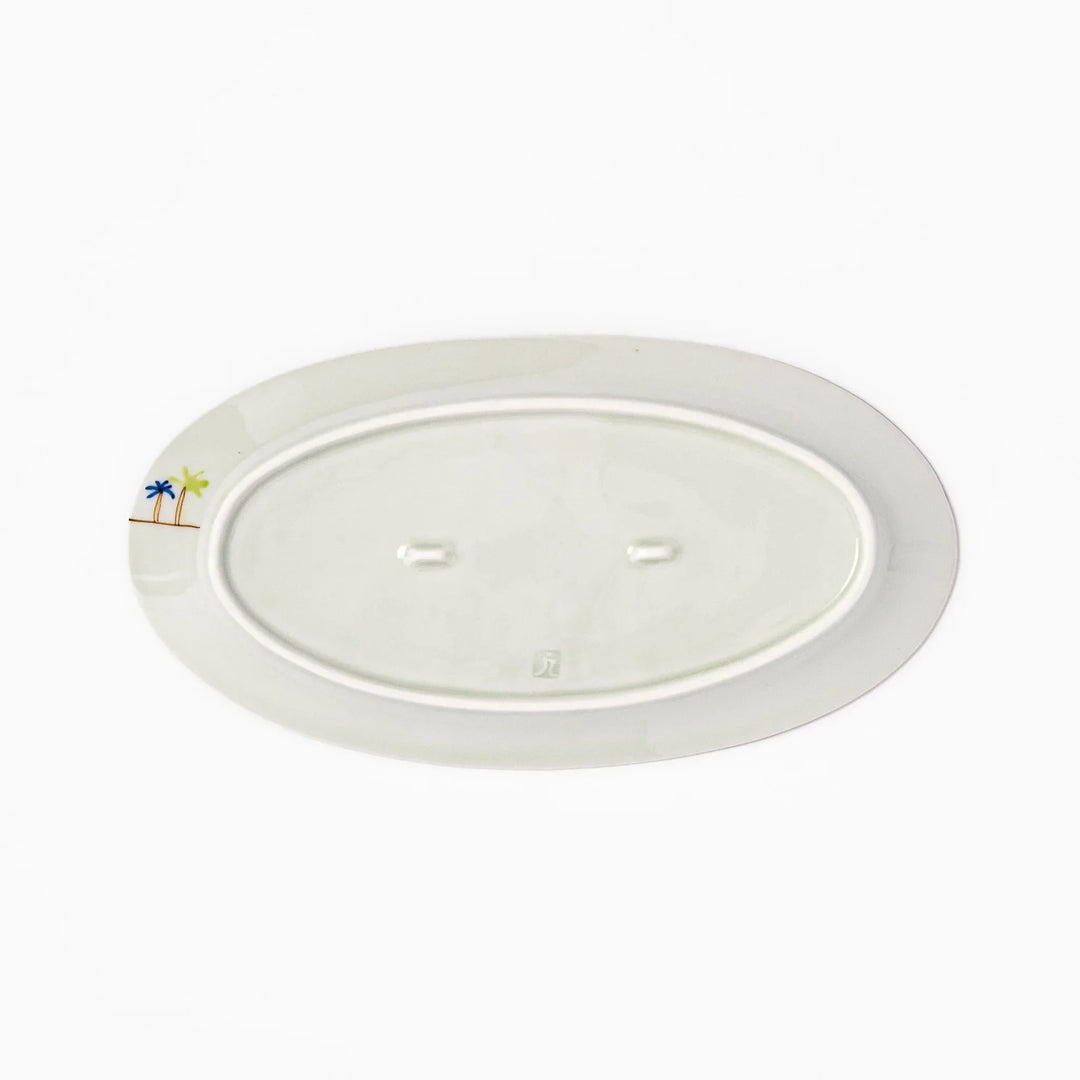 Japanese porcelain oval plate with whimsical Egypt design featuring pyramids, camel, palm trees, and desert-inspired details