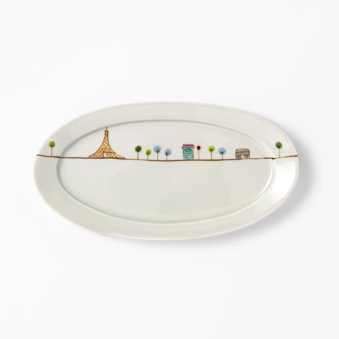Japanese porcelain oval plate with whimsical France design featuring Eiffel Tower, Arc de Triomphe, trees, and colorful house