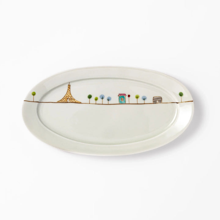 Japanese porcelain oval plate with whimsical France design featuring Eiffel Tower, Arc de Triomphe, trees, and colorful house