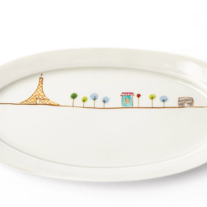 Japanese porcelain oval plate with whimsical France design featuring Eiffel Tower, Arc de Triomphe, trees, and colorful house