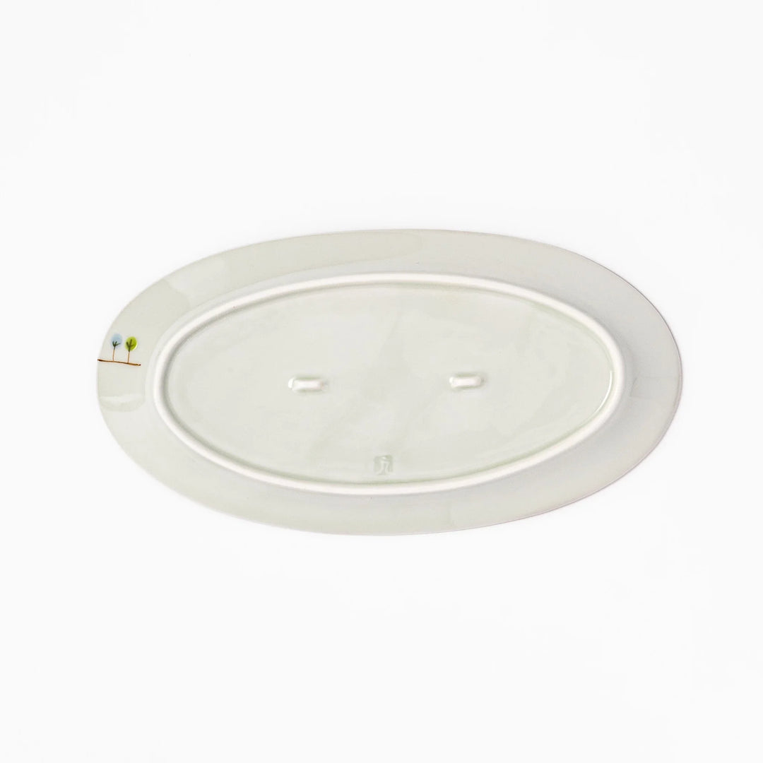 Japanese porcelain oval plate with whimsical France design featuring Eiffel Tower, Arc de Triomphe, trees, and colorful house