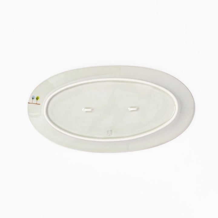 Japanese porcelain oval plate with whimsical France design featuring Eiffel Tower, Arc de Triomphe, trees, and colorful house