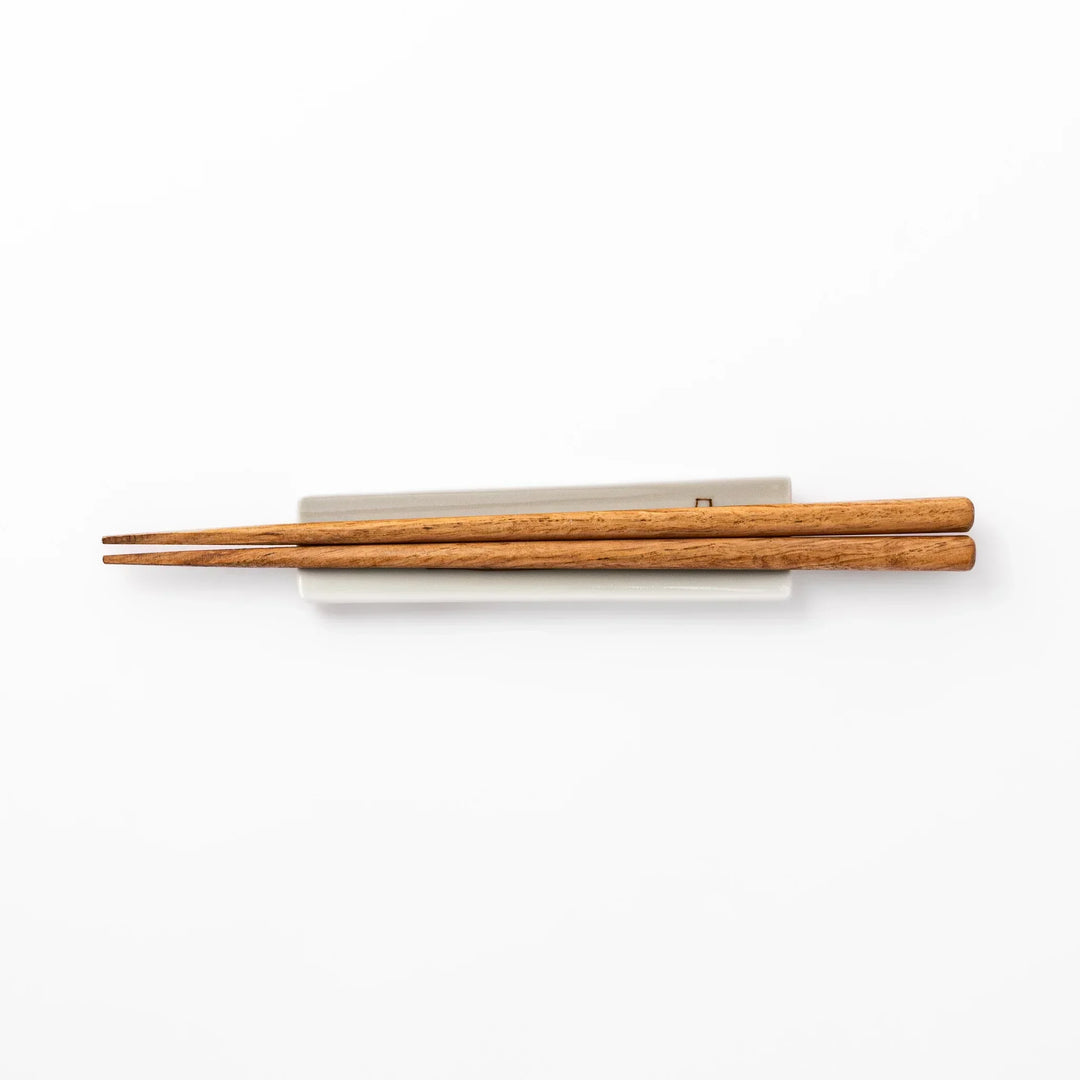 Japanese porcelain chopstick rest with whimsical Japan design featuring Mount Fuji, cherry blossoms, house, and colorful trees