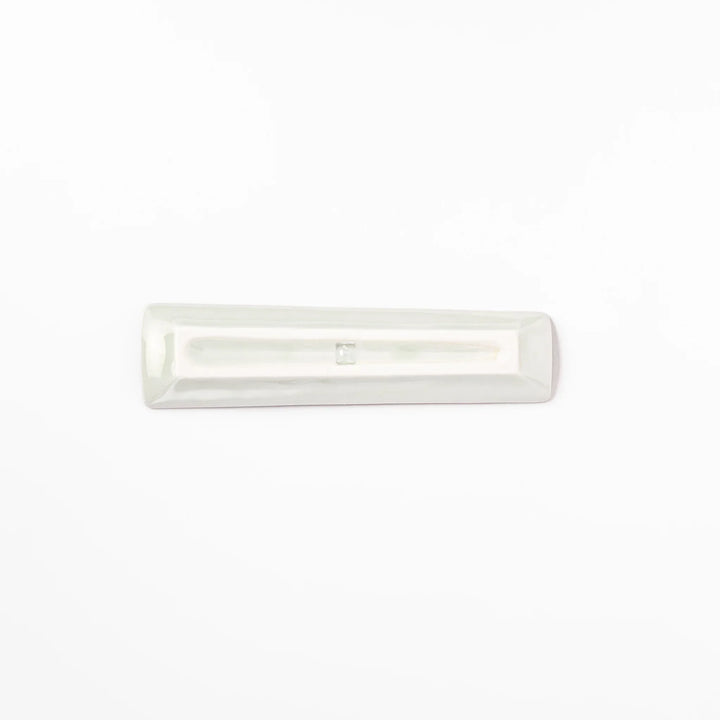 Japanese porcelain chopstick rest with whimsical Japan design featuring Mount Fuji, cherry blossoms, house, and colorful trees