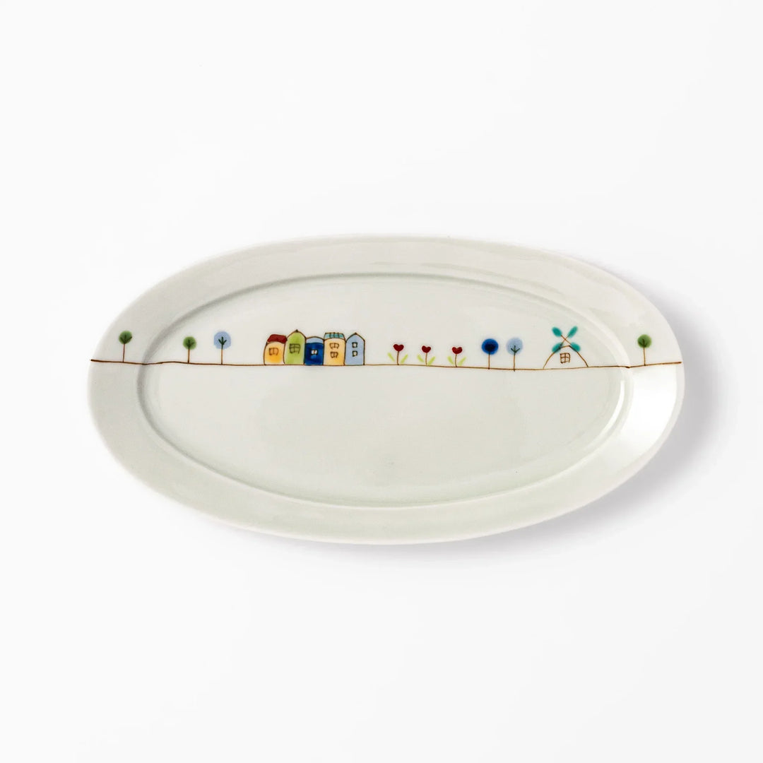Japanese porcelain oval plate with whimsical Netherlands design featuring colorful houses, tulips, trees, and a blue windmill