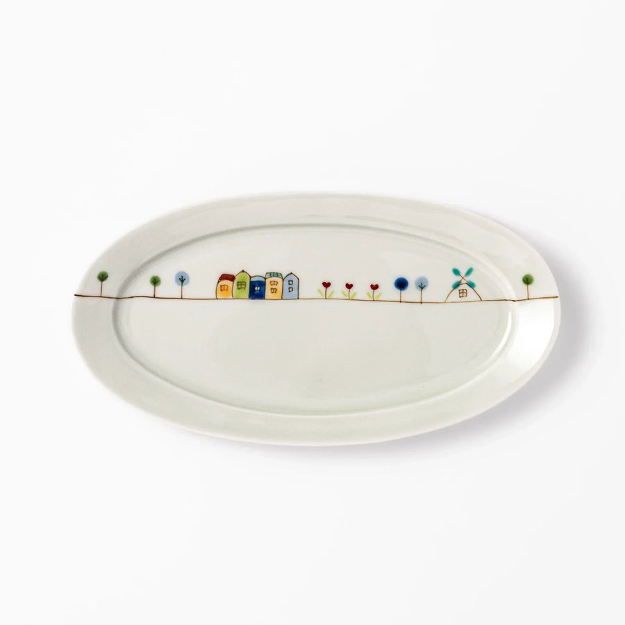 Japanese porcelain oval plate with whimsical Netherlands design featuring colorful houses, tulips, trees, and a blue windmill