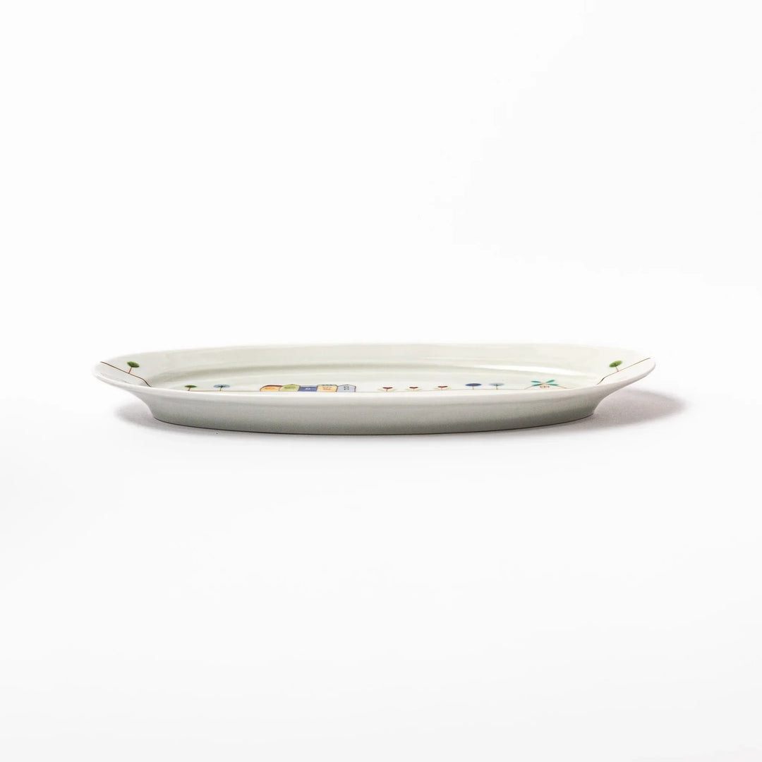Japanese porcelain oval plate with whimsical Netherlands design featuring colorful houses, tulips, trees, and a blue windmill