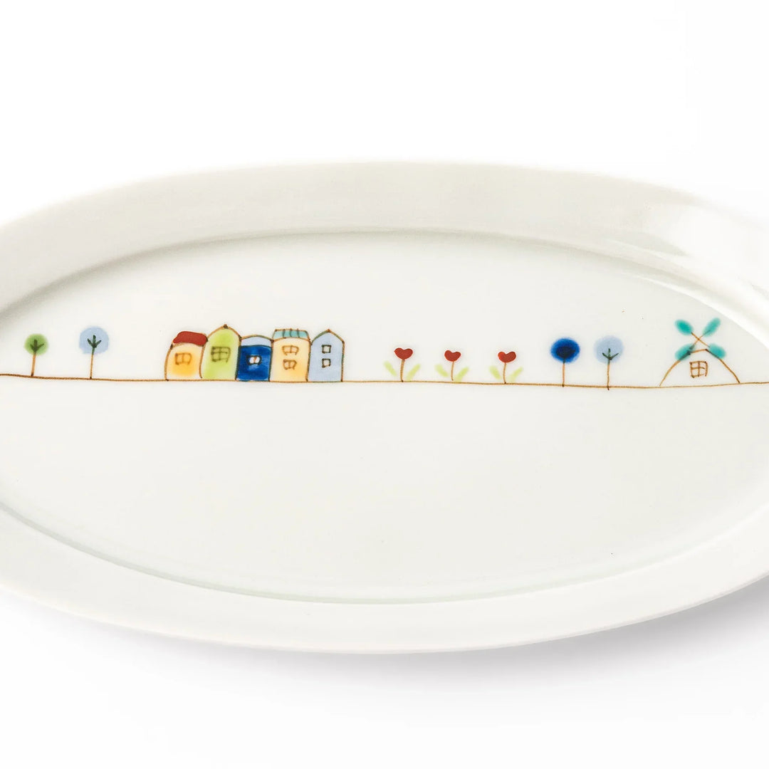 Japanese porcelain oval plate with whimsical Netherlands design featuring colorful houses, tulips, trees, and a blue windmill