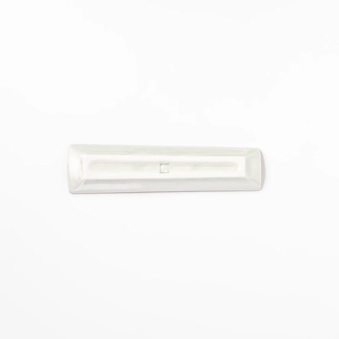 Japanese porcelain chopstick rest with USA design featuring Statue of Liberty, red bridge, and colorful cityscape accents