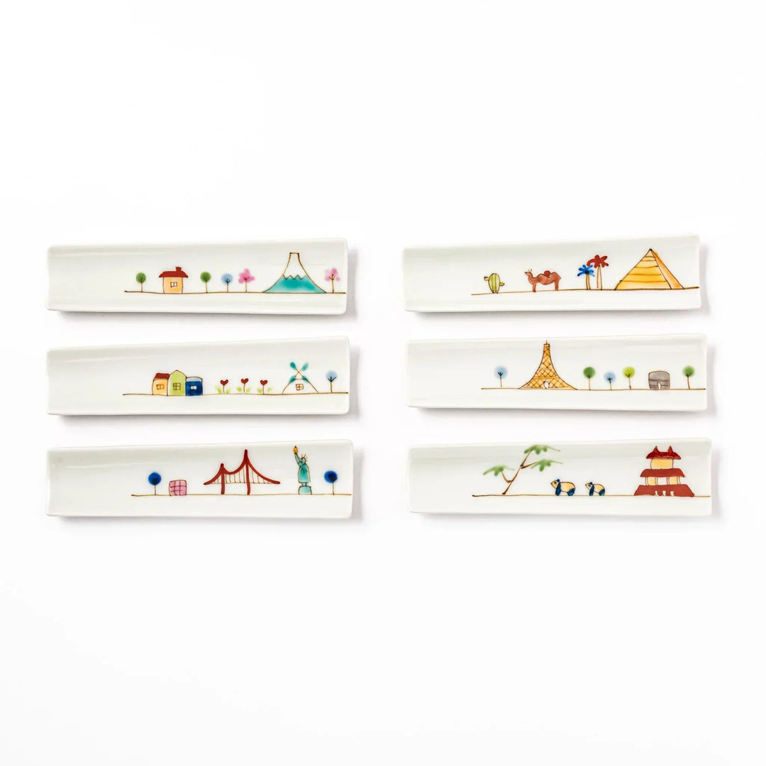 Set of six Japanese porcelain chopstick rests with whimsical world landmark designs including USA, Japan, France, and Egypt