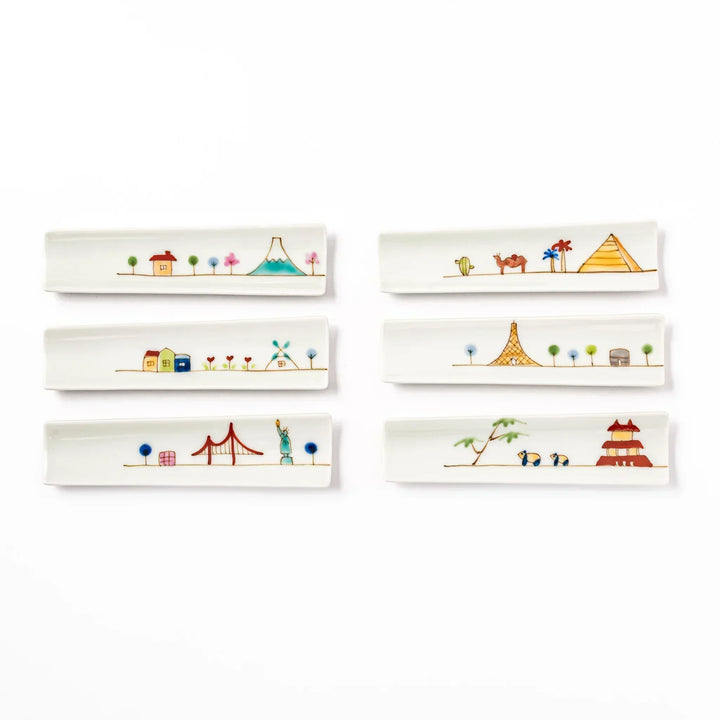 Set of six Japanese porcelain chopstick rests with whimsical world landmark designs including USA, Japan, France, and Egypt