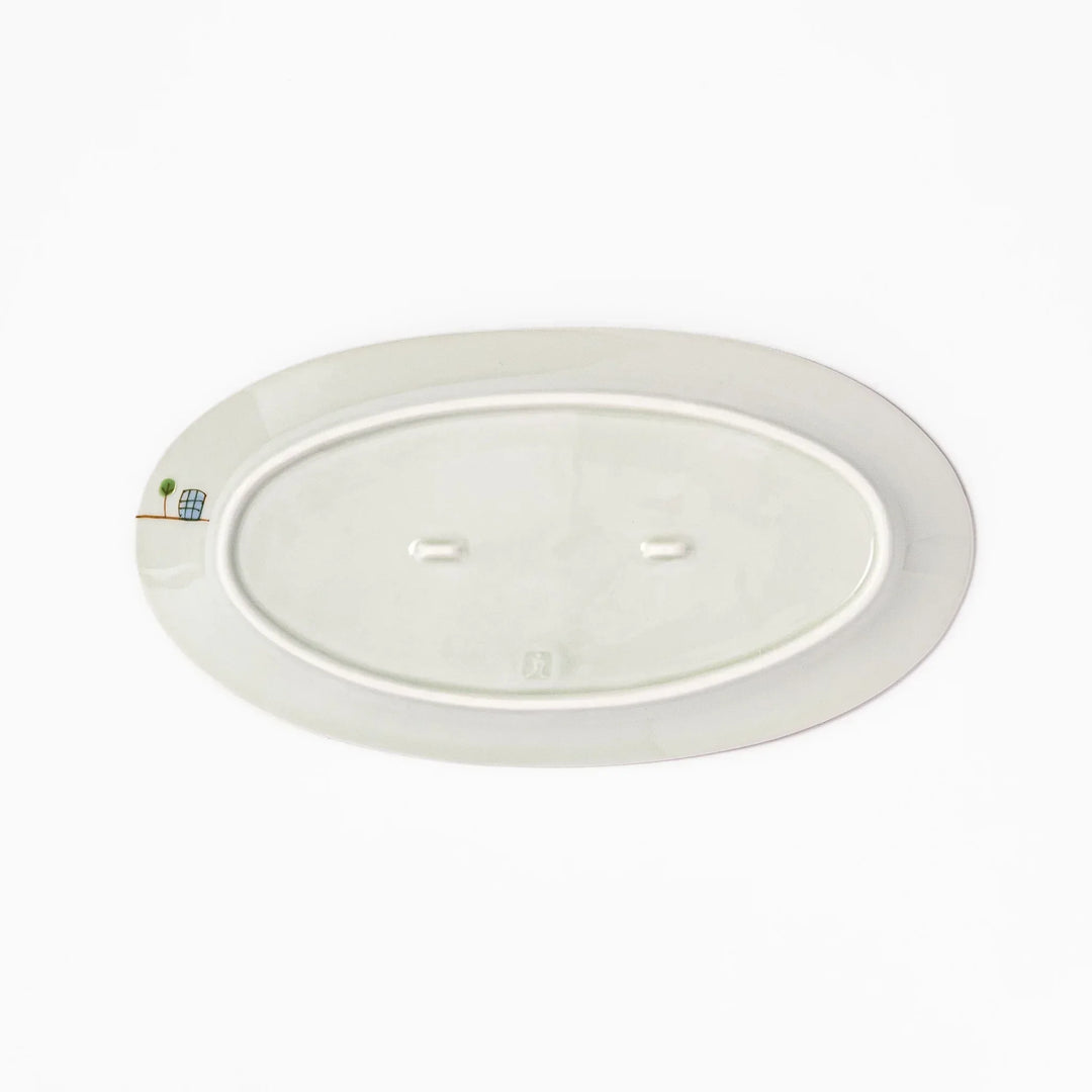 Japanese porcelain oval plate with playful USA cityscape design featuring Statue of Liberty, bridge, and colorful buildings