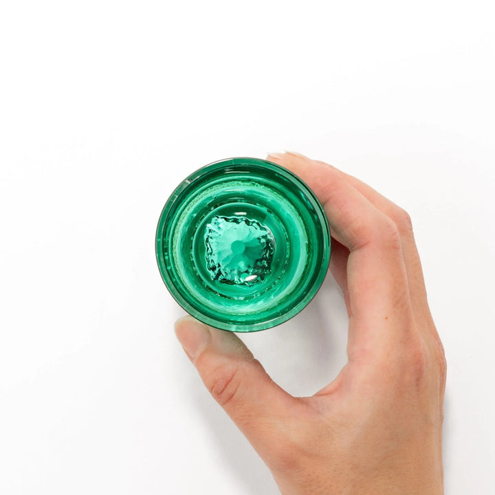 Green sake glass with gold-leaf mountain design and Mount Fuji base, combining elegance and Japanese artistry.