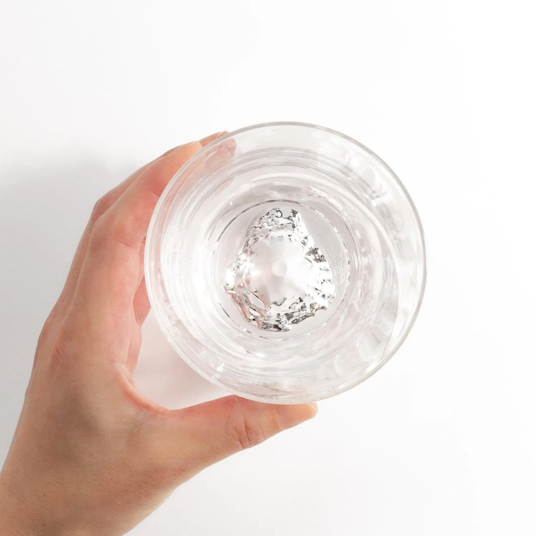 Clear rocks glass with etched starburst lattice pattern, swirling stripe detail, and textured 3D Mount Fuji base.