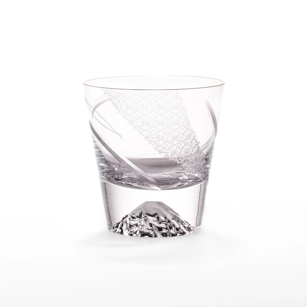 Clear glass tumbler with etched starburst motifs and diagonal swirl atop 3D Mount Fuji base for drinks.