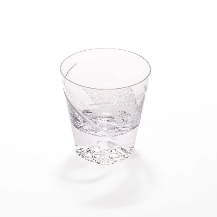 Clear glass tumbler with etched starburst motifs and diagonal swirl atop 3D Mount Fuji base for drinks.