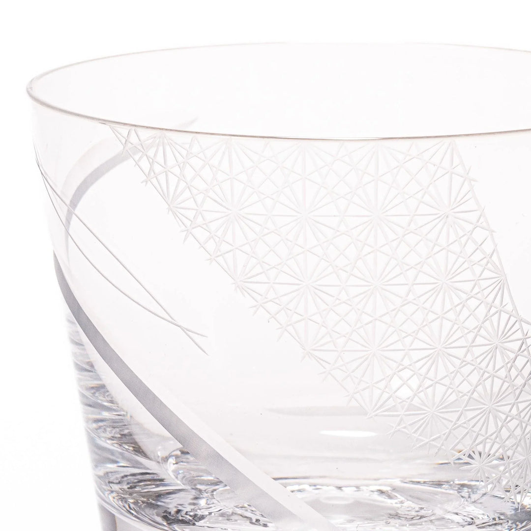 Clear glass tumbler with etched starburst motifs and diagonal swirl atop 3D Mount Fuji base for drinks.