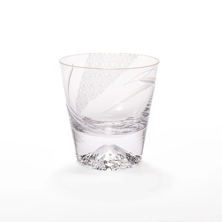 Clear glass tumbler with etched starburst motifs and diagonal swirl atop 3D Mount Fuji base for drinks.