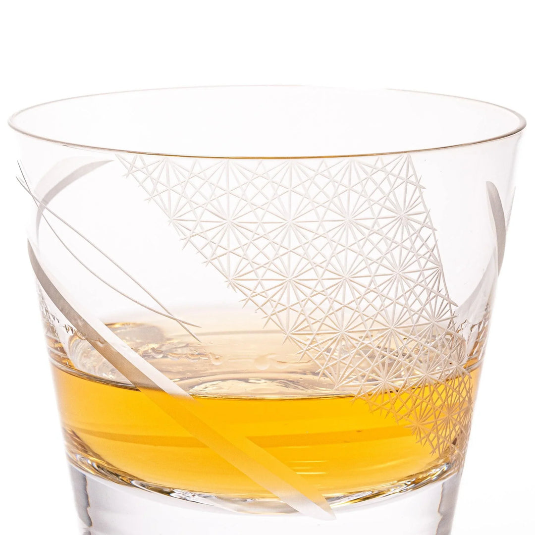 Clear glass tumbler with etched starburst motifs and diagonal swirl atop 3D Mount Fuji base for drinks.