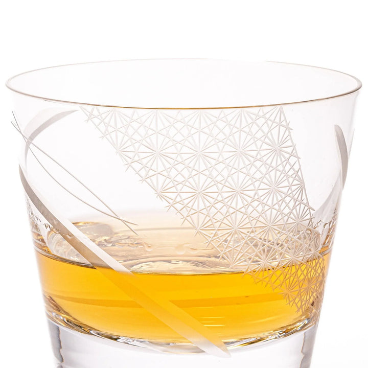 Clear glass tumbler with etched starburst motifs and diagonal swirl atop 3D Mount Fuji base for drinks.