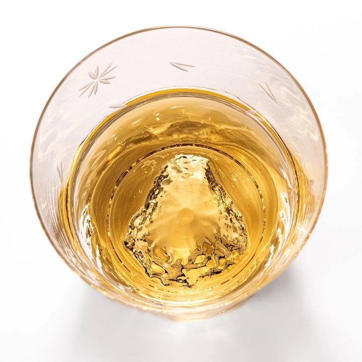 Two Edo glass whiskey cups in wooden box with Mount Fuji base design showcasing Japanese craftsmanship.