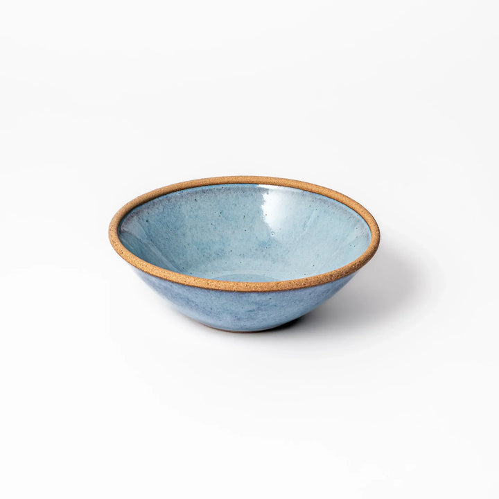 Terracotta blue ceramic cereal bowl with rustic brown rim, handcrafted in Japan for serving cereal, soup, or salad.