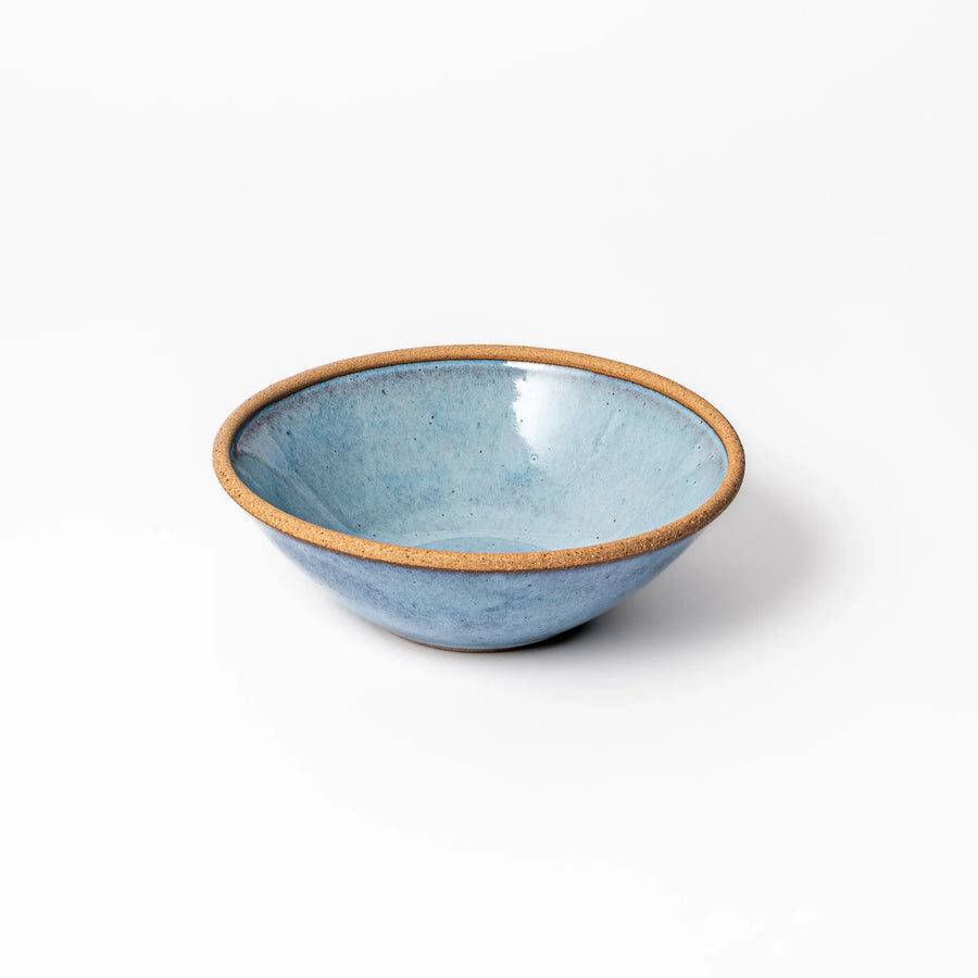 Terracotta blue ceramic cereal bowl with rustic brown rim, handcrafted in Japan for serving cereal, soup, or salad.