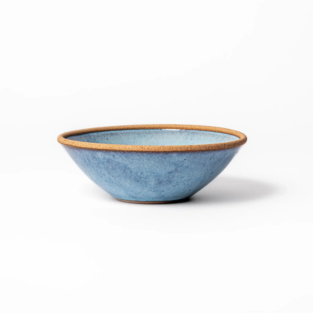 Terracotta blue ceramic cereal bowl with rustic brown rim, handcrafted in Japan for serving cereal, soup, or salad.