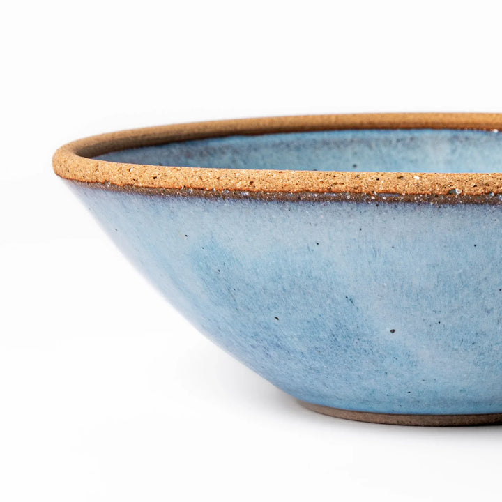 Terracotta blue ceramic cereal bowl with rustic brown rim, handcrafted in Japan for serving cereal, soup, or salad.