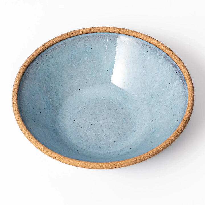 Terracotta blue ceramic cereal bowl with rustic brown rim, handcrafted in Japan for serving cereal, soup, or salad.