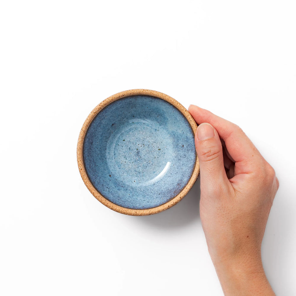 Terracotta blue ceramic dessert bowl with rustic brown rim, handcrafted in Japan for serving ice cream, fruit, or sides.