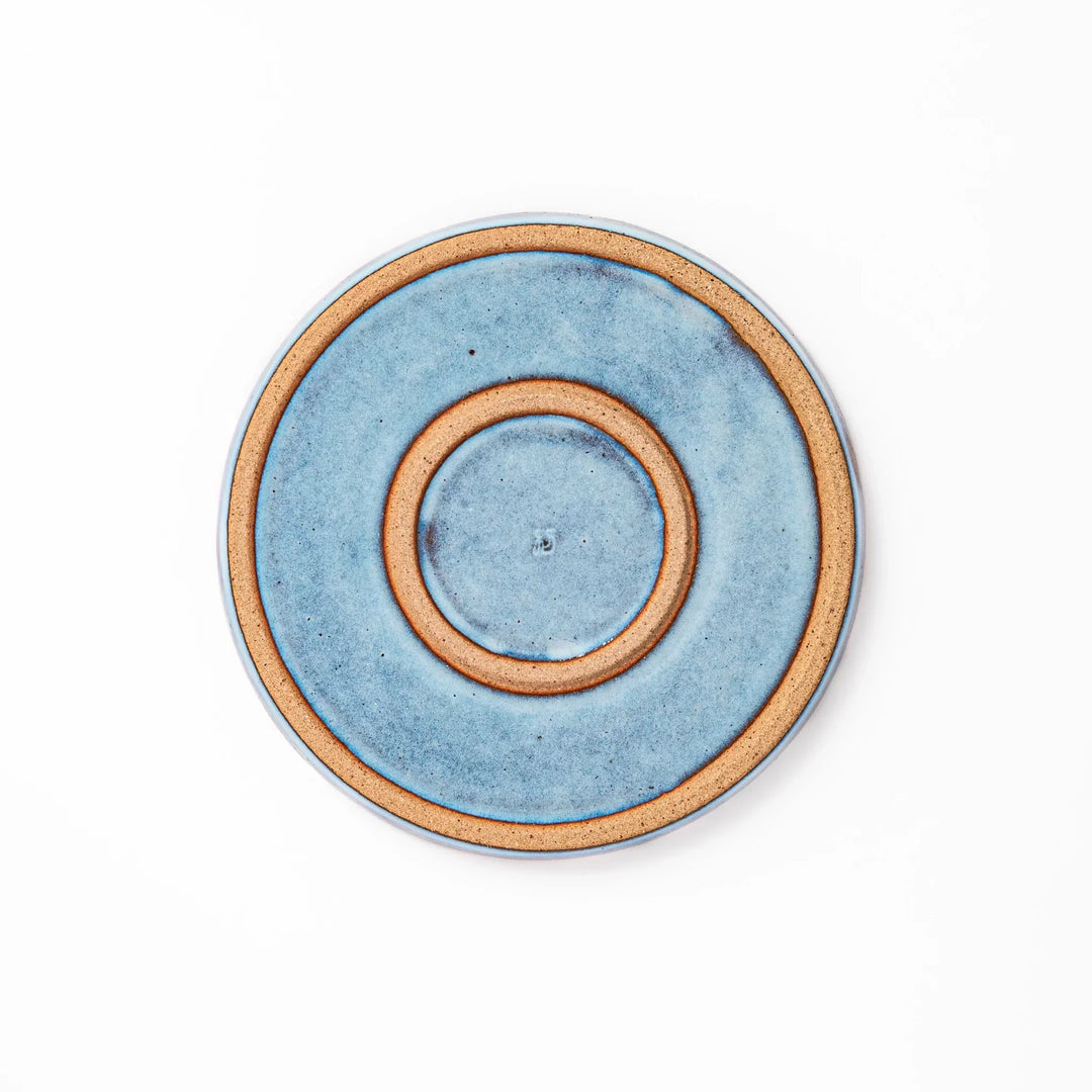 Terracotta blue ceramic dessert plate with rustic brown rim, handcrafted in Japan for serving cake, pastry, or appetizers.