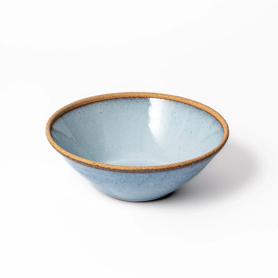 Terracotta blue ceramic pasta bowl with rustic brown rim, handcrafted in Japan for pasta, curry, or salads.