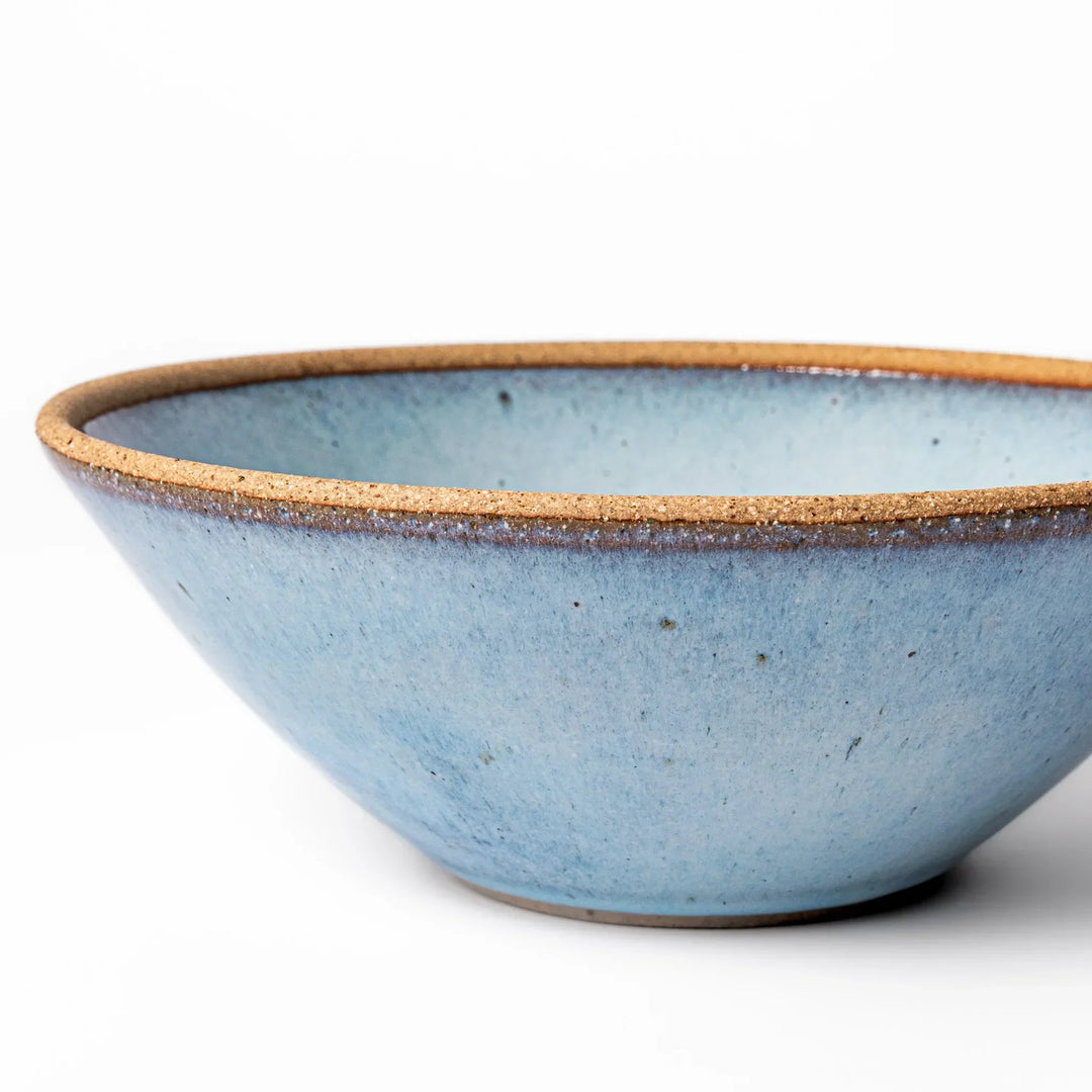 Terracotta blue ceramic pasta bowl with rustic brown rim, handcrafted in Japan for pasta, curry, or salads.