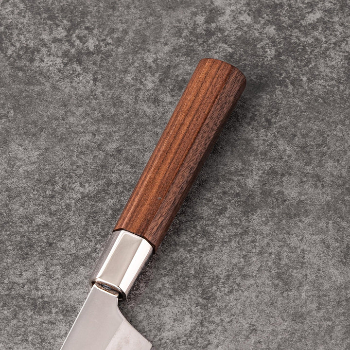 Petty knife with polished stainless steel blade and walnut wood handle for precise vegetable slicing and peeling.