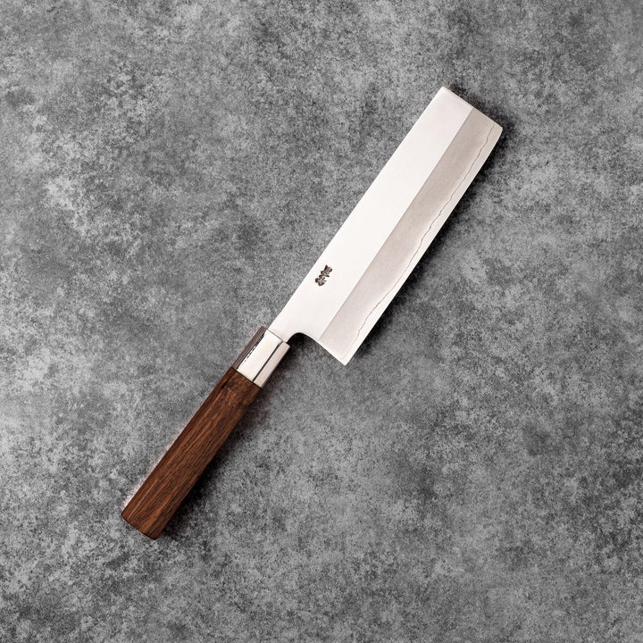 Tosa ginsan nakiri vegetable knife authentic japanese chef knife with wooden handle on textured stone background cutlery