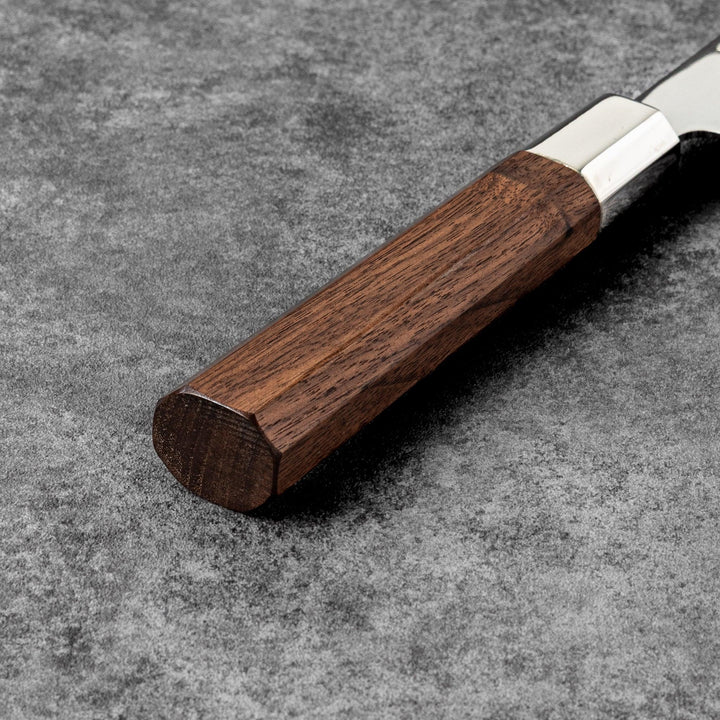 Tosa ginsan nakiri vegetable knife authentic japanese chef knife with wooden handle on textured stone background cutlery