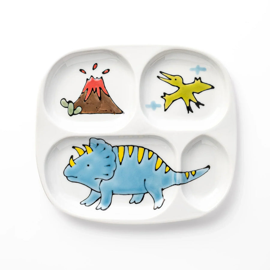 White ceramic kids divided plate with blue triceratops, yellow pterodactyl, red erupting volcano and blue cloud accents