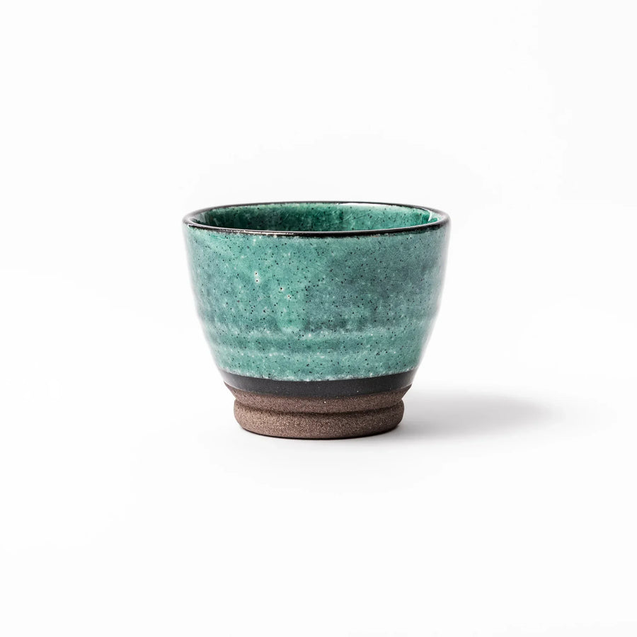 Turkish blue Japanese ceramic sake cup with rustic brown base and textured glaze, ideal for enjoying traditional sake